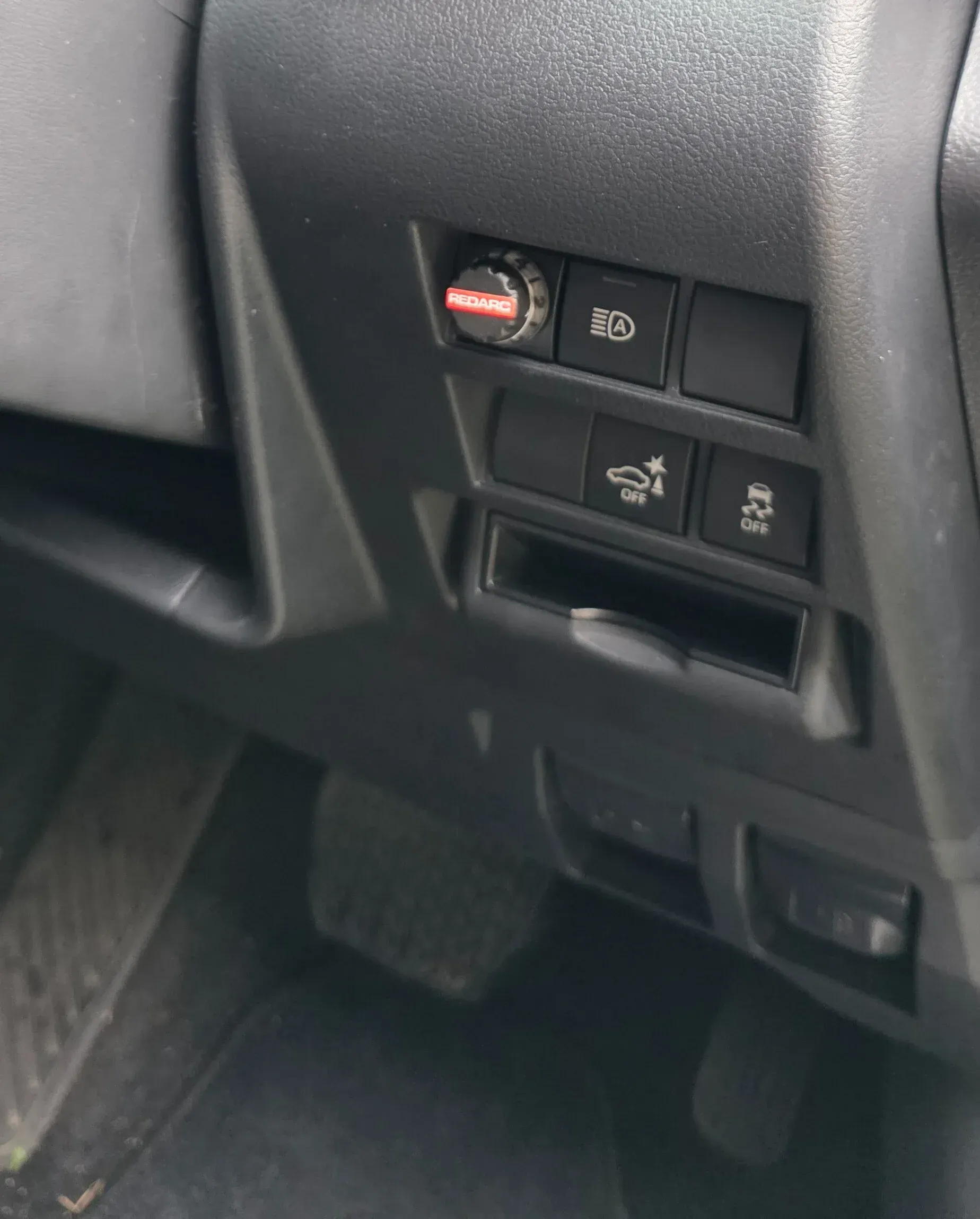 Dashboard with buttons: dial, hazard lights, USB port, and an off-road button. Black interior. — Hinterland Towbar & Steel Fabrication In Southside, QLD