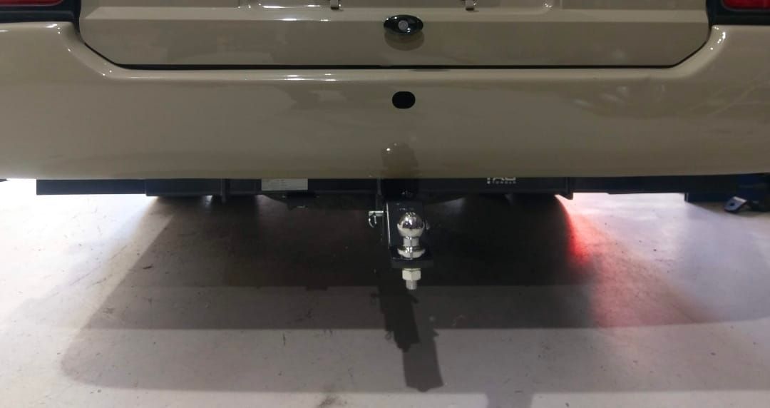 Close-up of a Tan Vehicle's Rear Bumper — Hinterland Towbars in Yandina, QLD