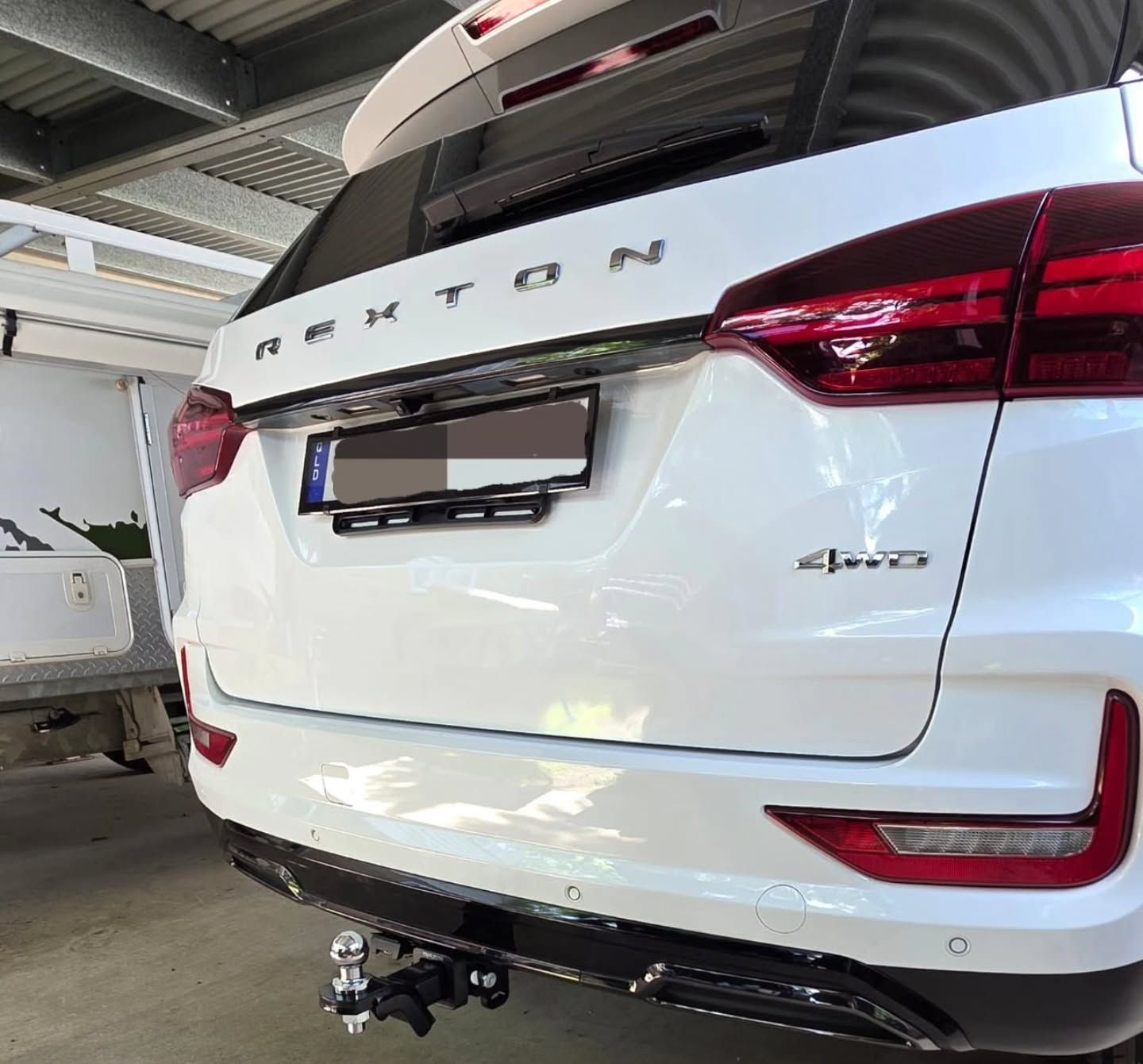 White Ssangyong Rexton Suv, Rear View, Showing the Brand Badge — Hinterland Towbars in Noosa, QLD