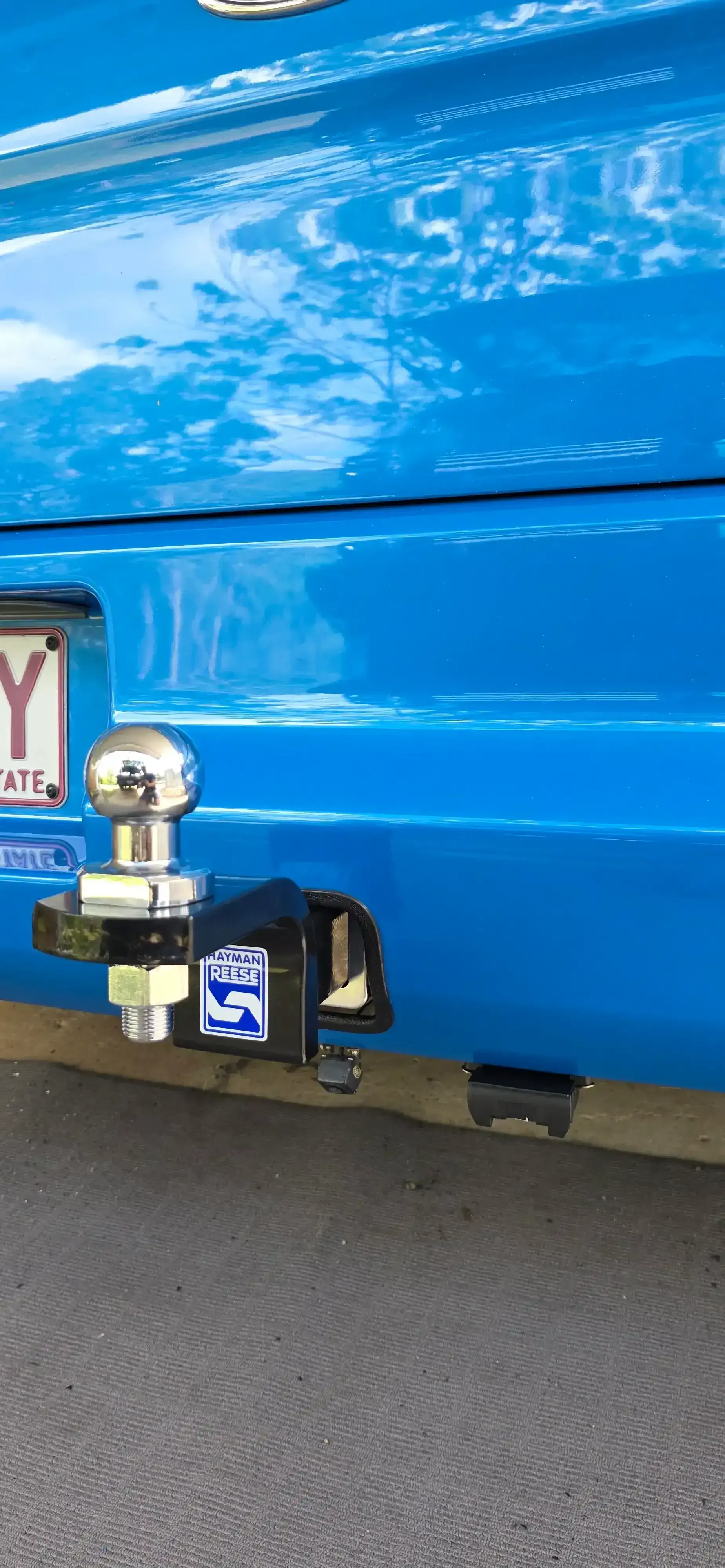 Blue car bumper with a silver trailer hitch and a license plate. — Hinterland Towbar & Steel Fabrication In Southside, QLD