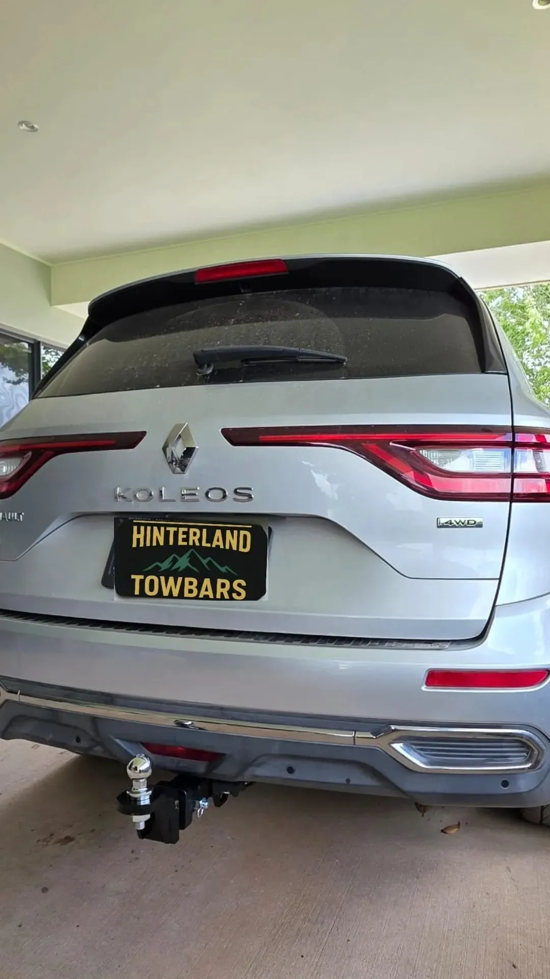 Silver Renault Koleos SUV with a Hinterland Towbars license plate, parked outdoors. — Hinterland Towbar & Steel Fabrication
