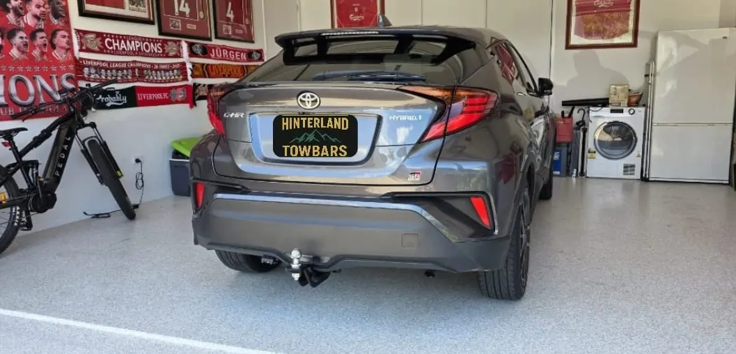 Gray Toyota C-hr Parked in a Garage With a License Plate — Hinterland Towbars in Noosa, QLD