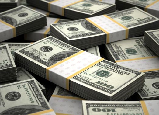 Stacks of $100 bills secured with paper bands.