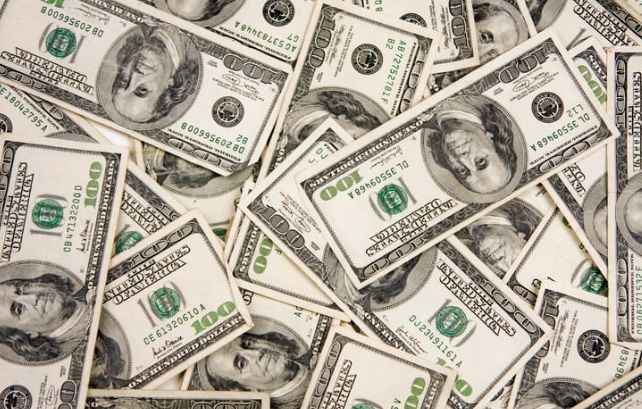 Pile of United States one hundred dollar bills.