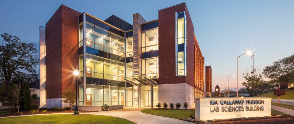 A large brick building with a sign in front of it that says lab sciences building.