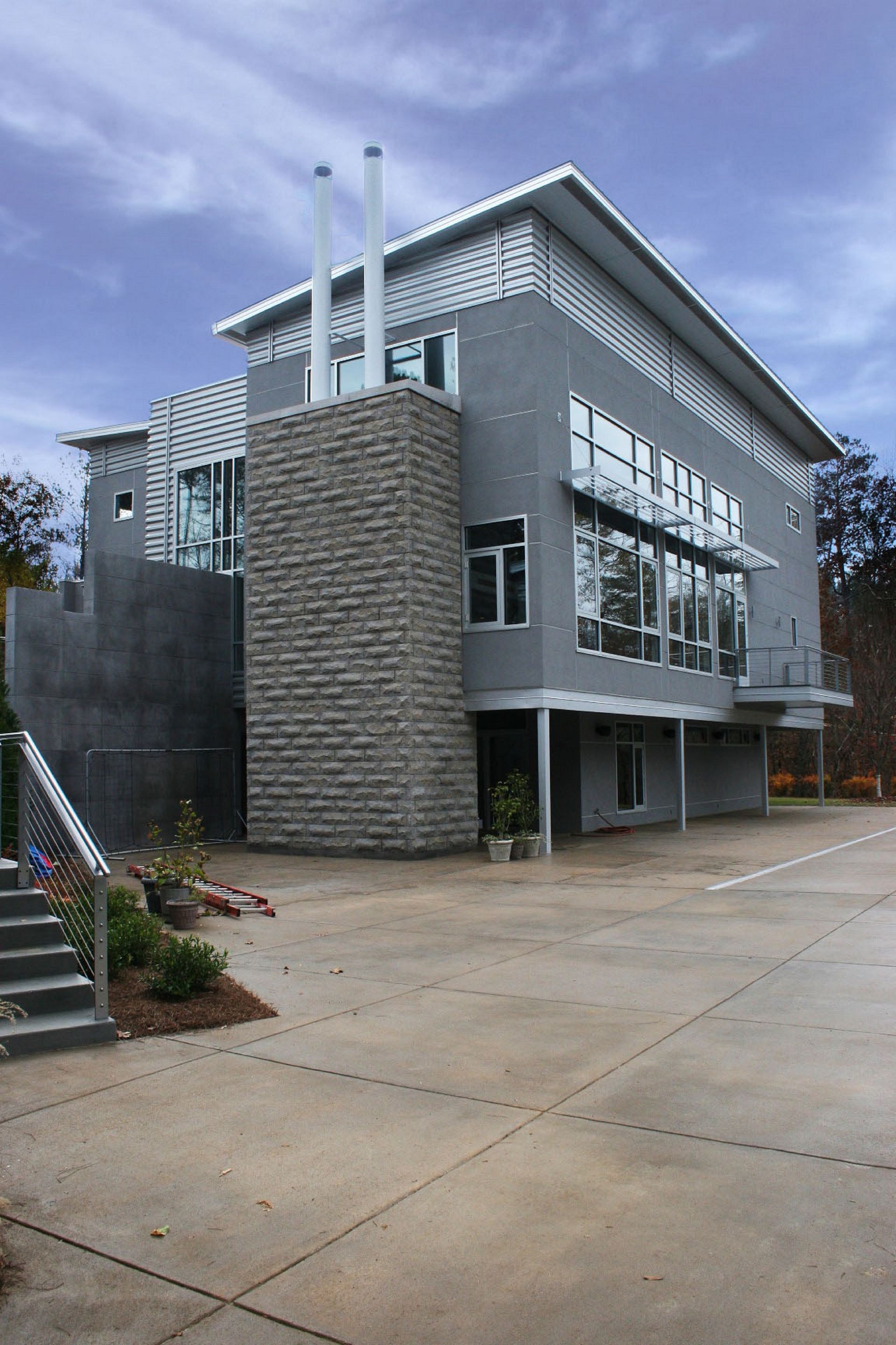 A large building with a lot of windows and stairs in front of it