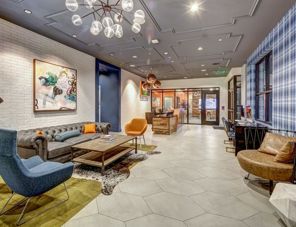 A living room filled with furniture and a chandelier.