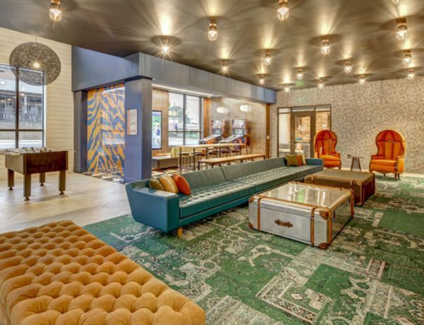 A living room filled with furniture and a foosball table.