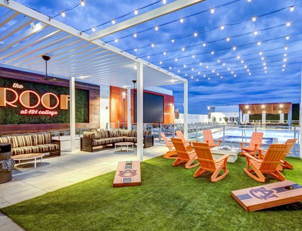 There are a lot of chairs and a pool in the background.