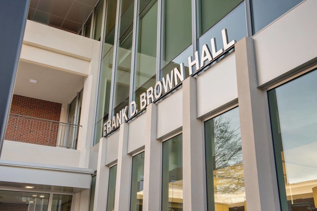 A large building with a sign that says frank d. brown hall