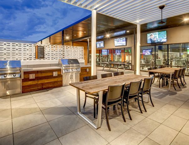 There is a large table and chairs in the middle of the room.