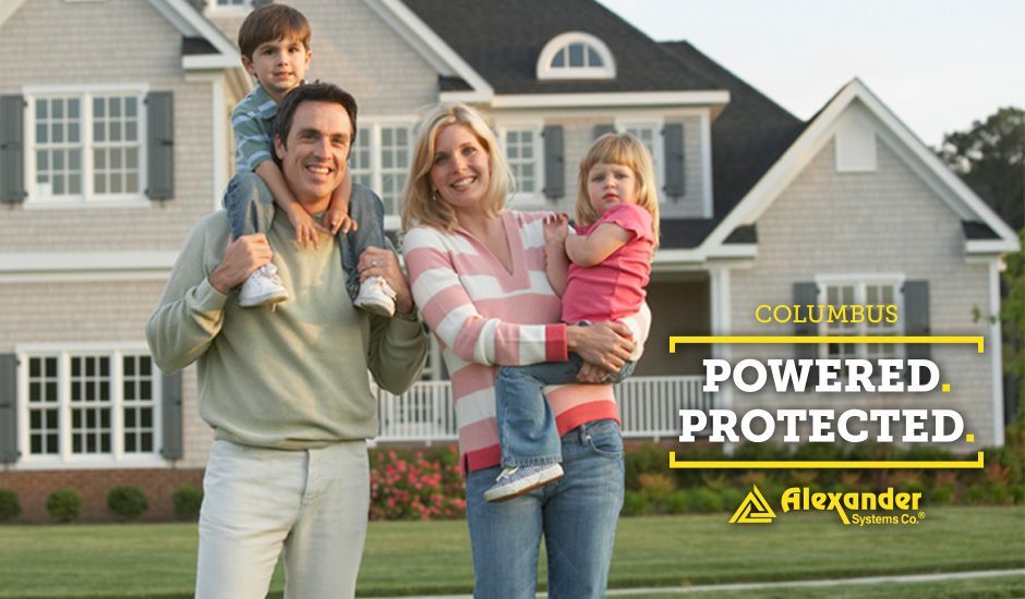 A family standing in front of a house that is powered and protected