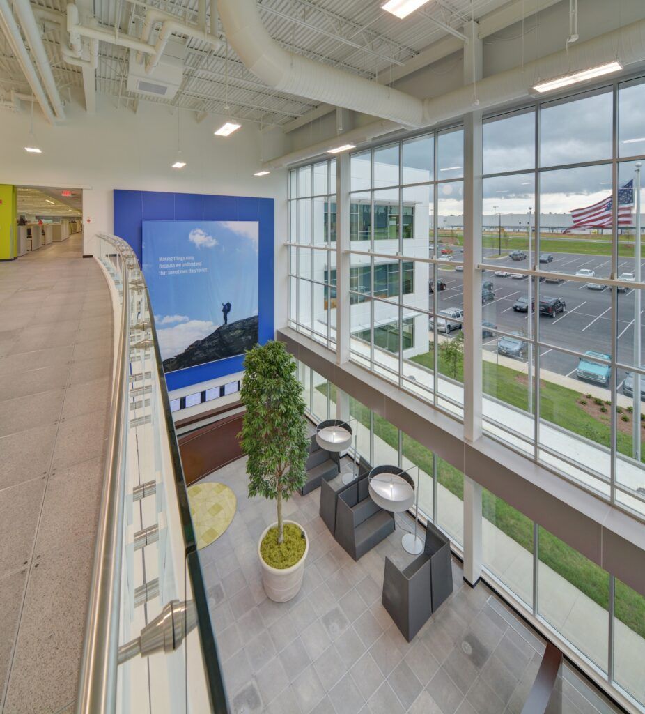 A large room with lots of windows and a picture on the wall