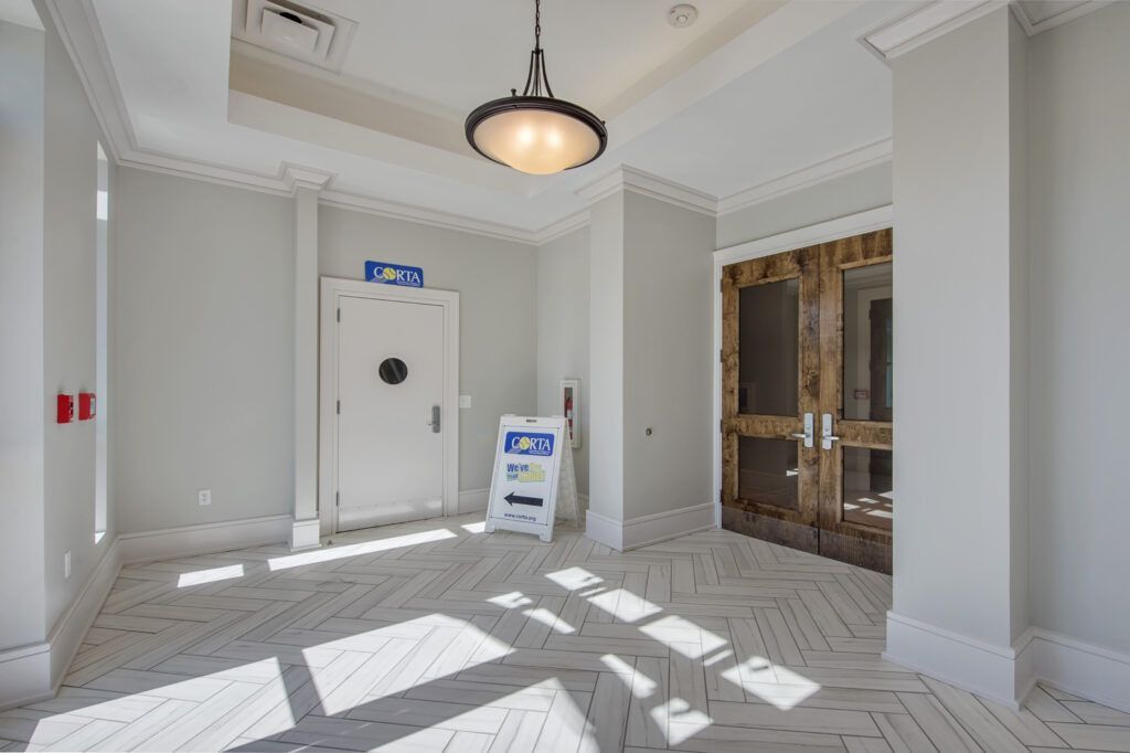 An empty room with a sign that says jct on it.