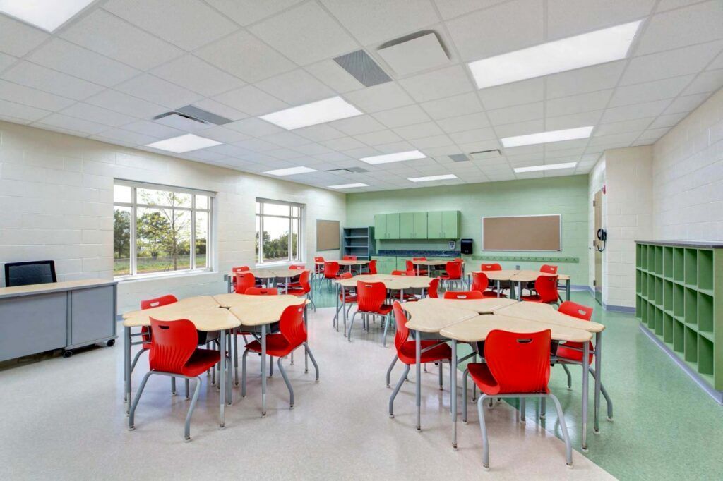 A large room with tables and chairs in it