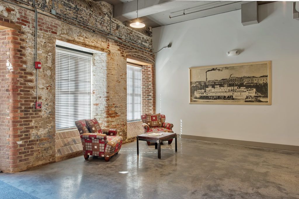 A living room with two chairs and a coffee table