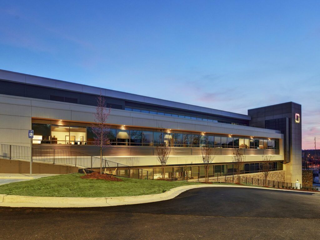 A large building with the letter c on the top of it