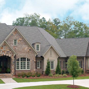 A large brick house with a gray roof