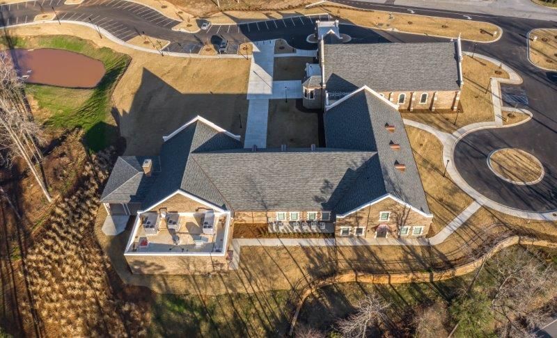 An aerial view of a large house with a lot of windows