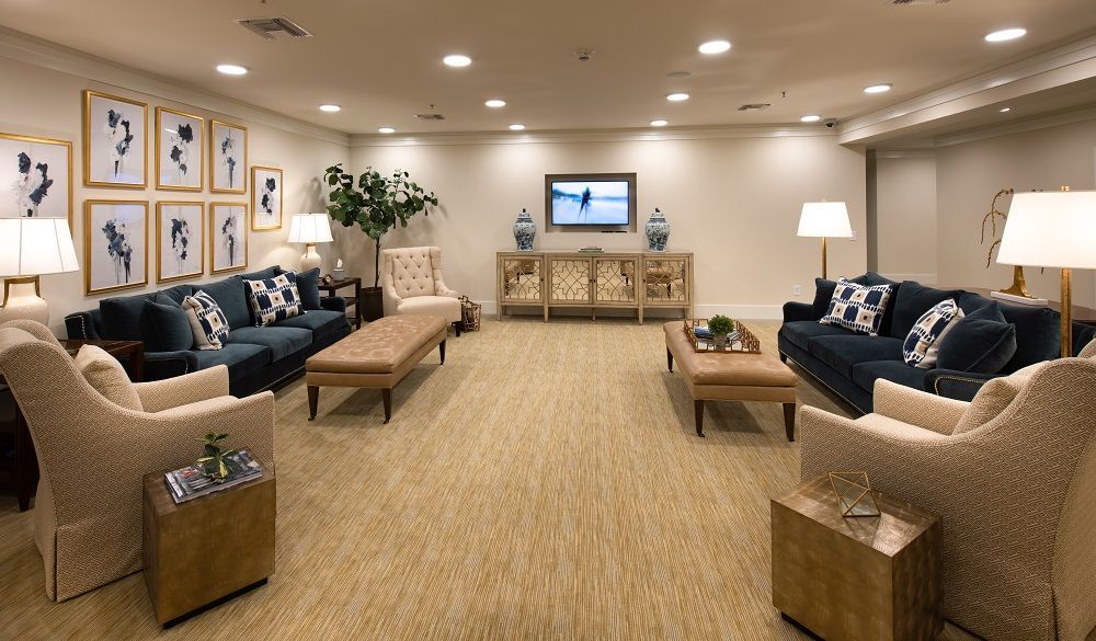 A living room filled with furniture and a television.