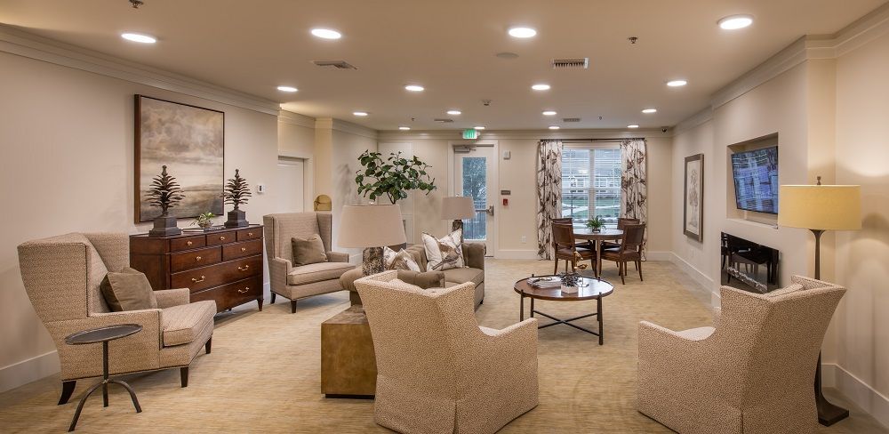 A living room filled with furniture and a fireplace.