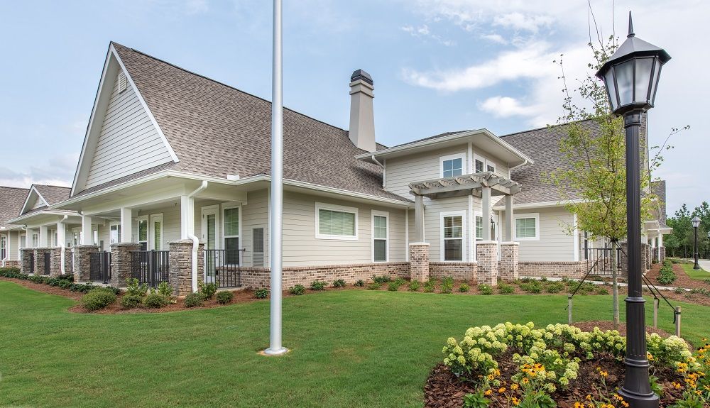 A large house with a flag pole in front of it