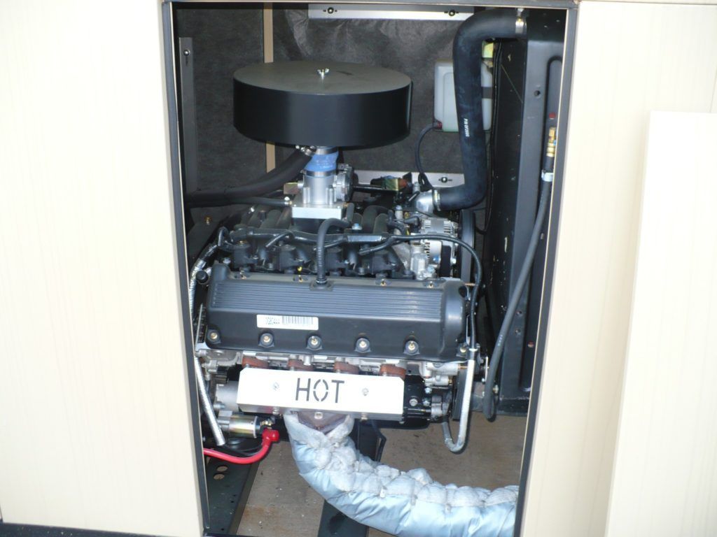 A black engine with a sign that says hot on it