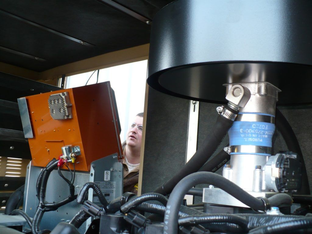 A close up of a machine with a hose that says ' a ' on it