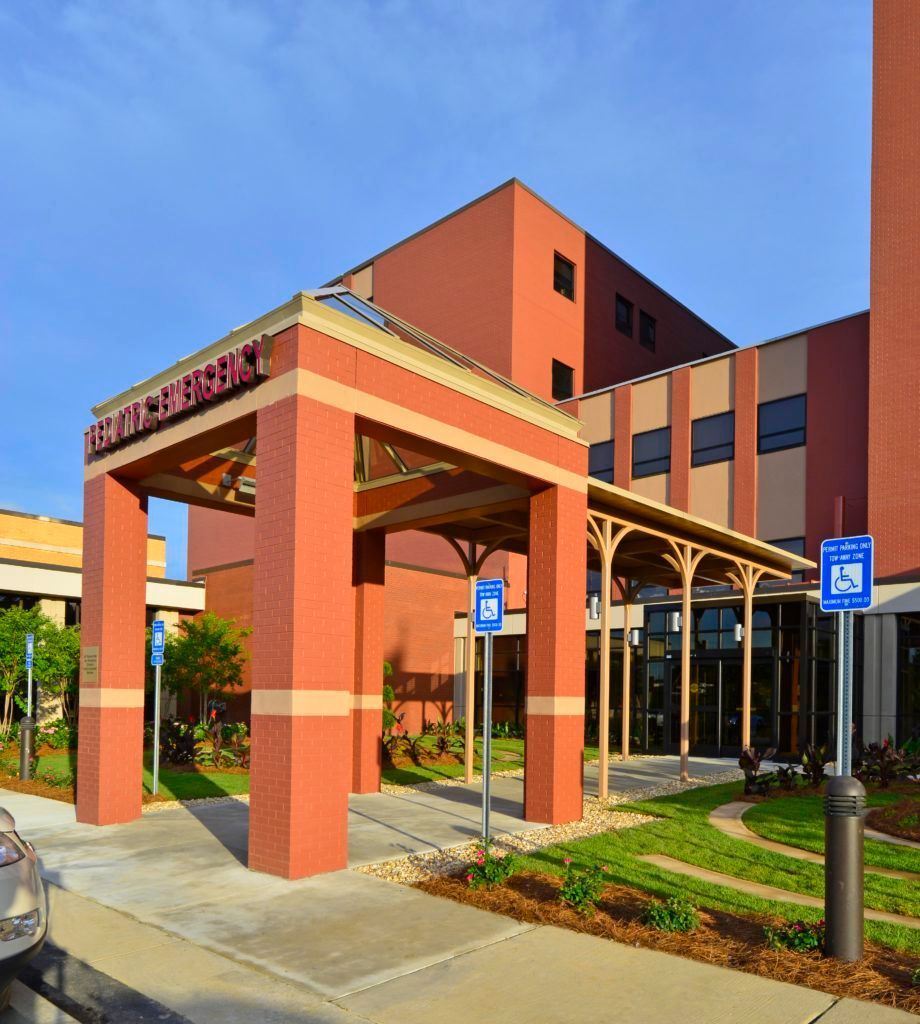 A large brick building with a sign that says health care center