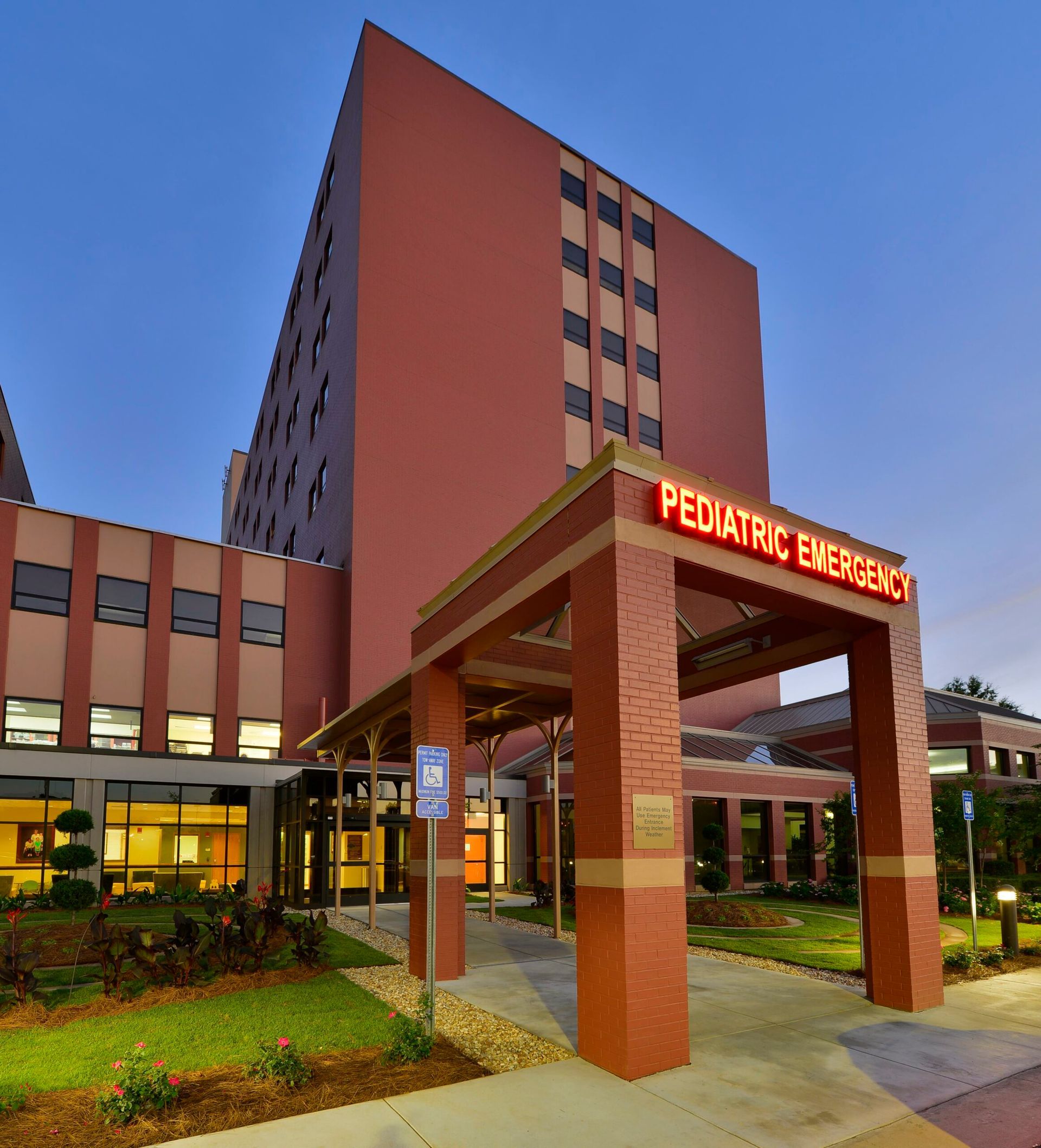 A large building with a sign that says pediatric emergency