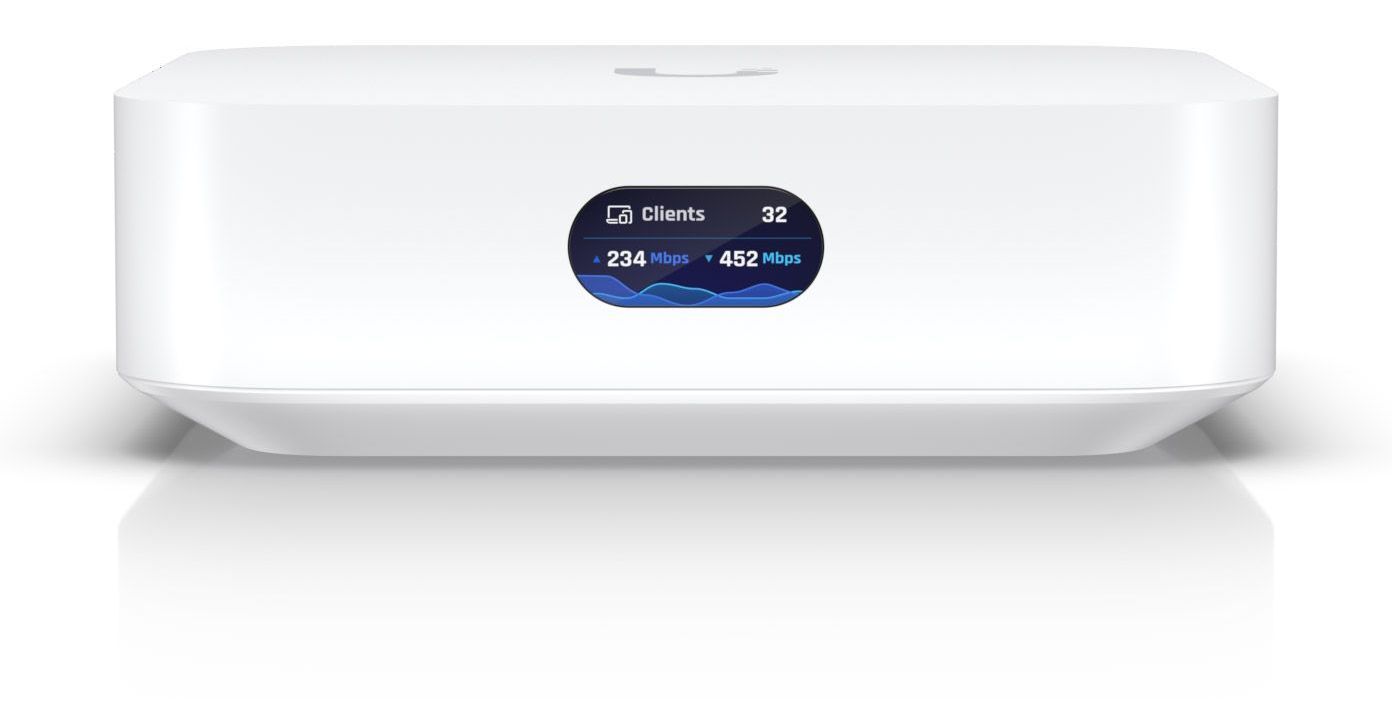 A white Ubiquiti modem box with a blue screen on it is sitting on a white surface.