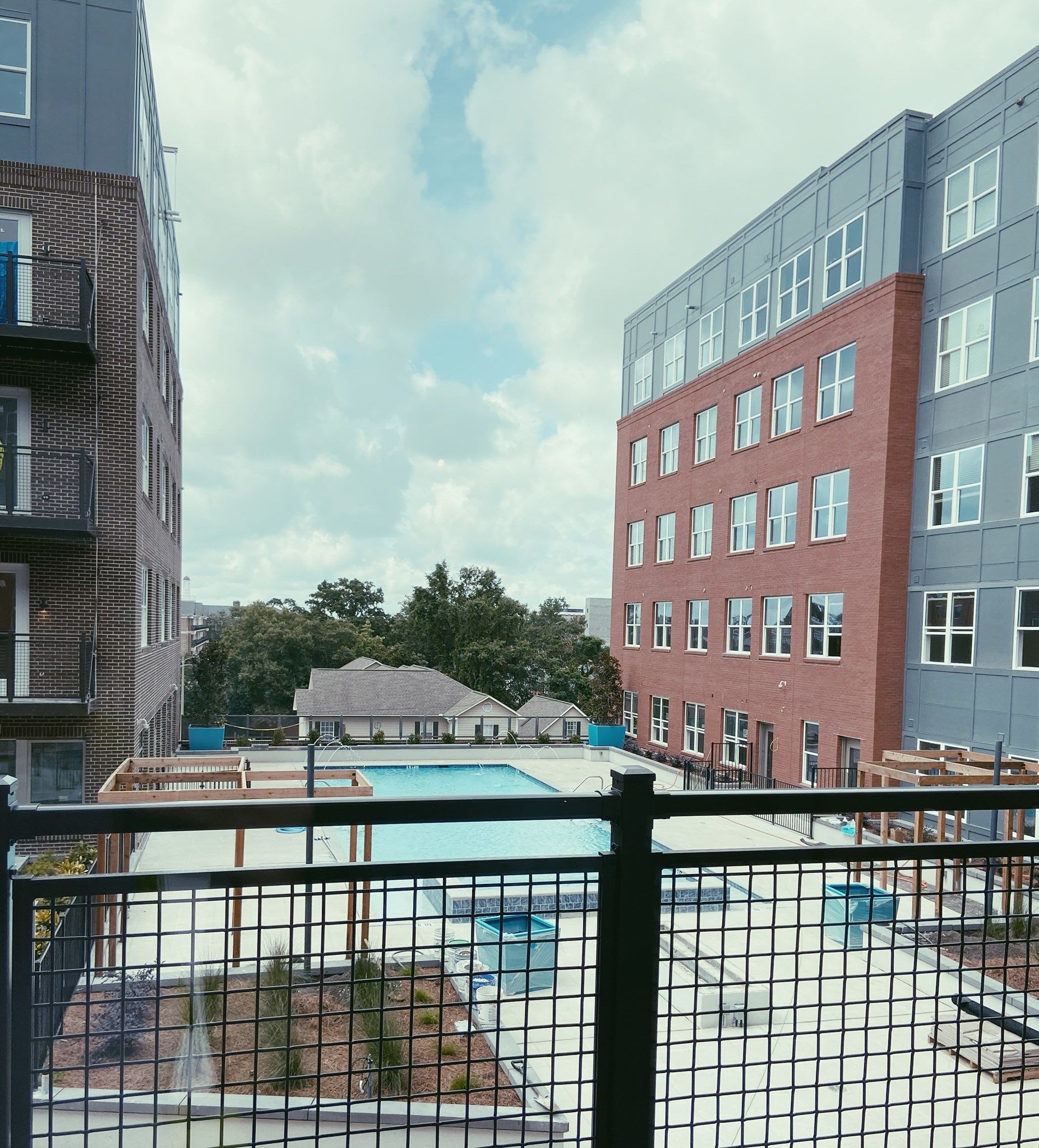 A large building with a pool in front of it