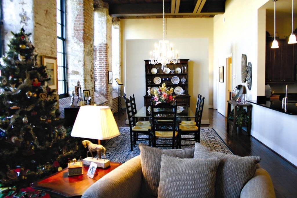 A living room with a couch and a christmas tree