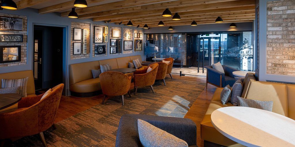 A large living room filled with furniture and tables.