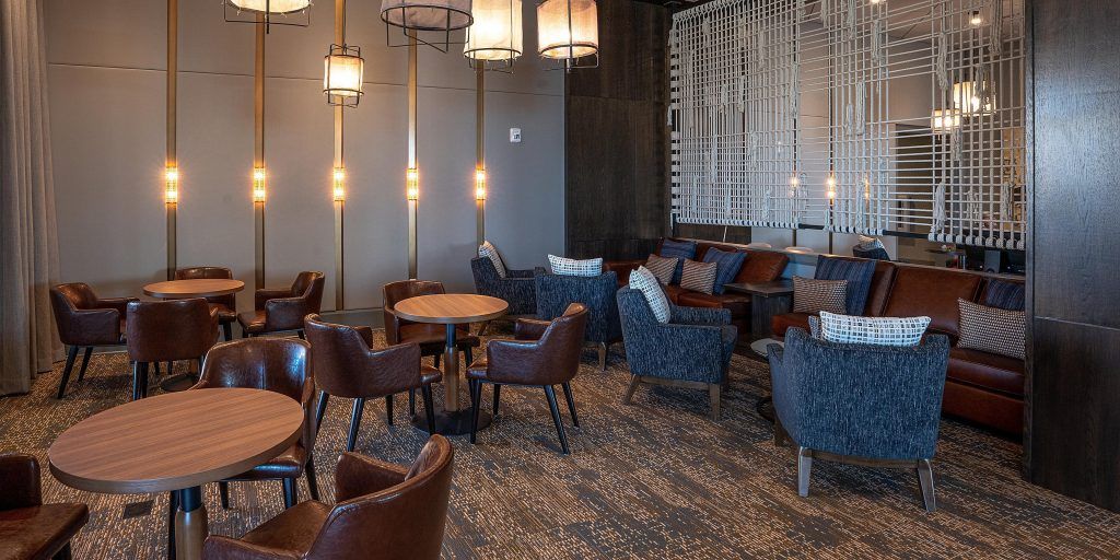 A large room with tables and chairs in it.