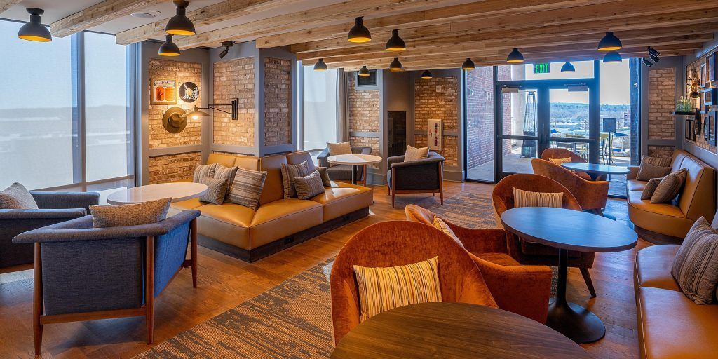 A large living room filled with furniture and tables.
