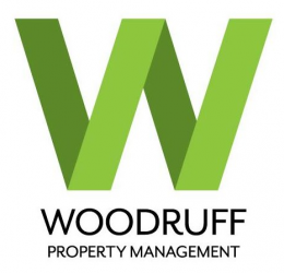 A green and black logo for woodruff property management