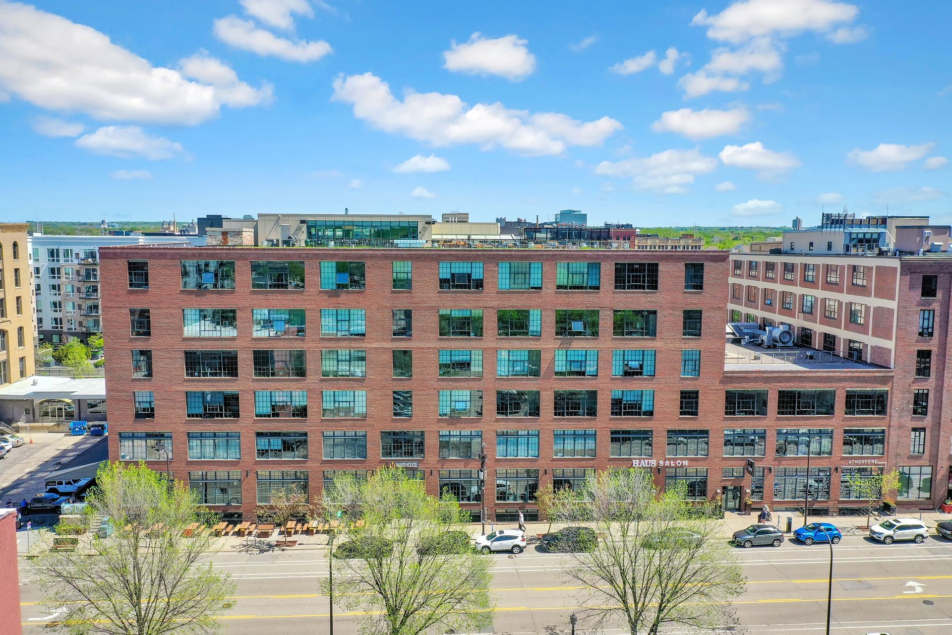 An aerial view of a large brick building with a lot of windows.