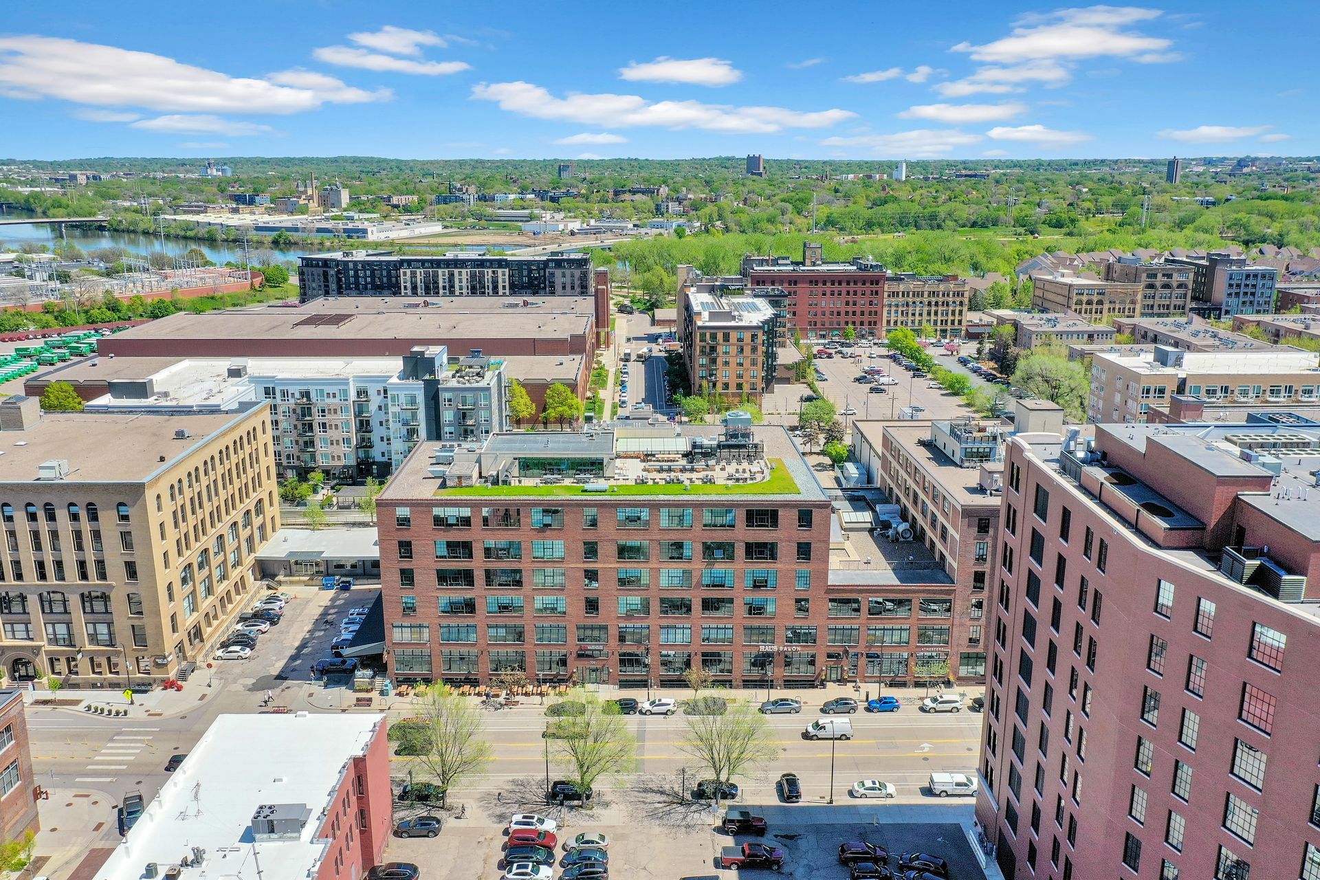 An aerial view of a city with lots of buildings and trees