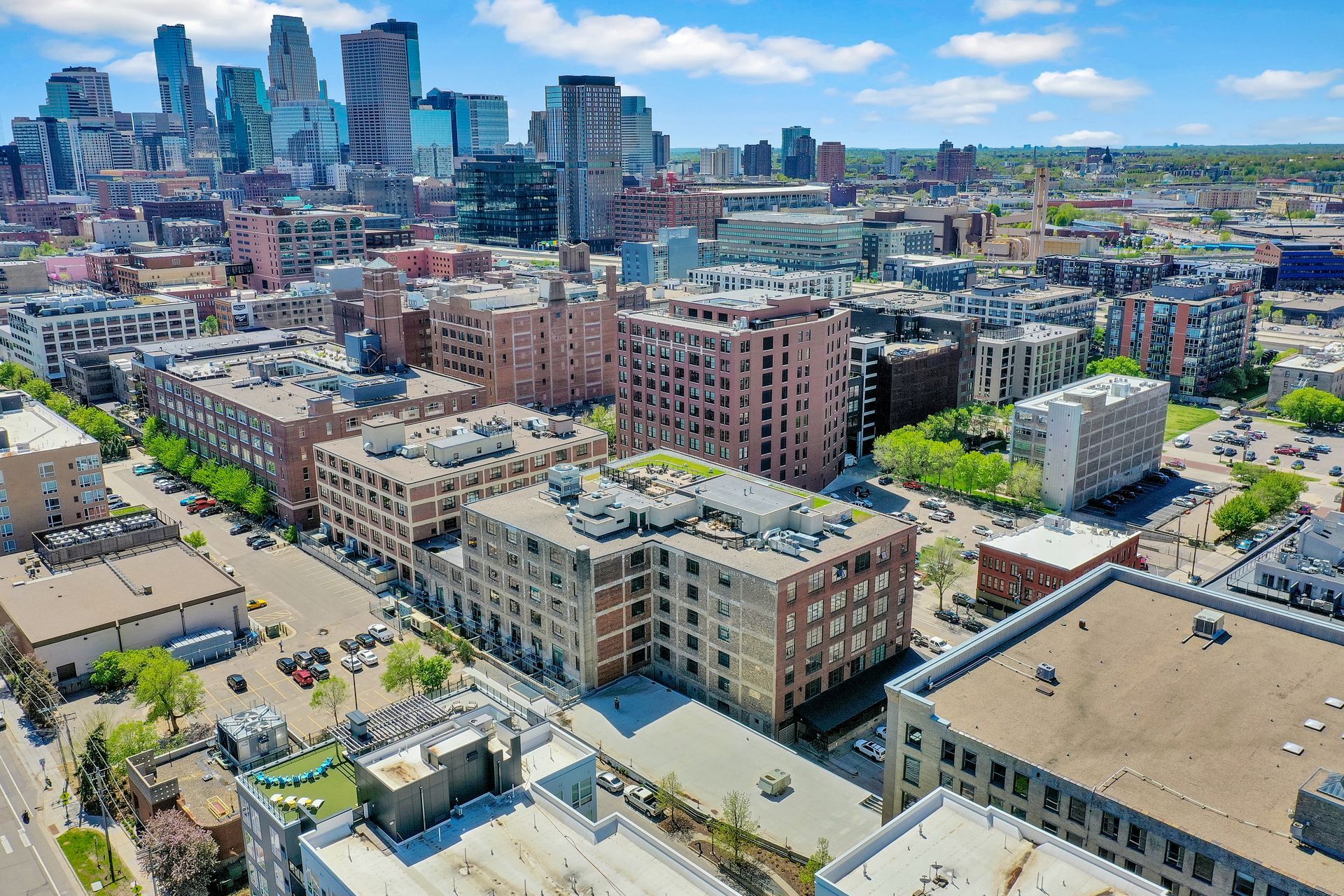 An aerial view of a city with a lot of buildings and trees.