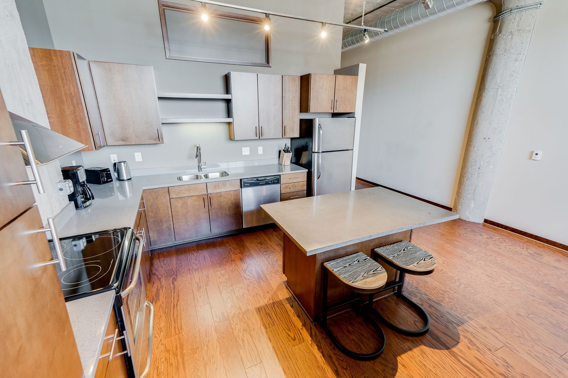 A kitchen with a table and chairs in it