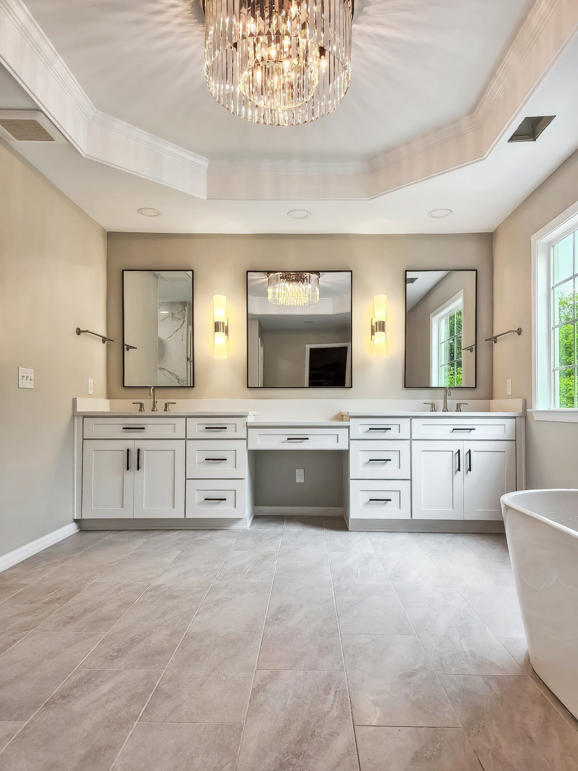 A bathroom with two sinks and a bathtub