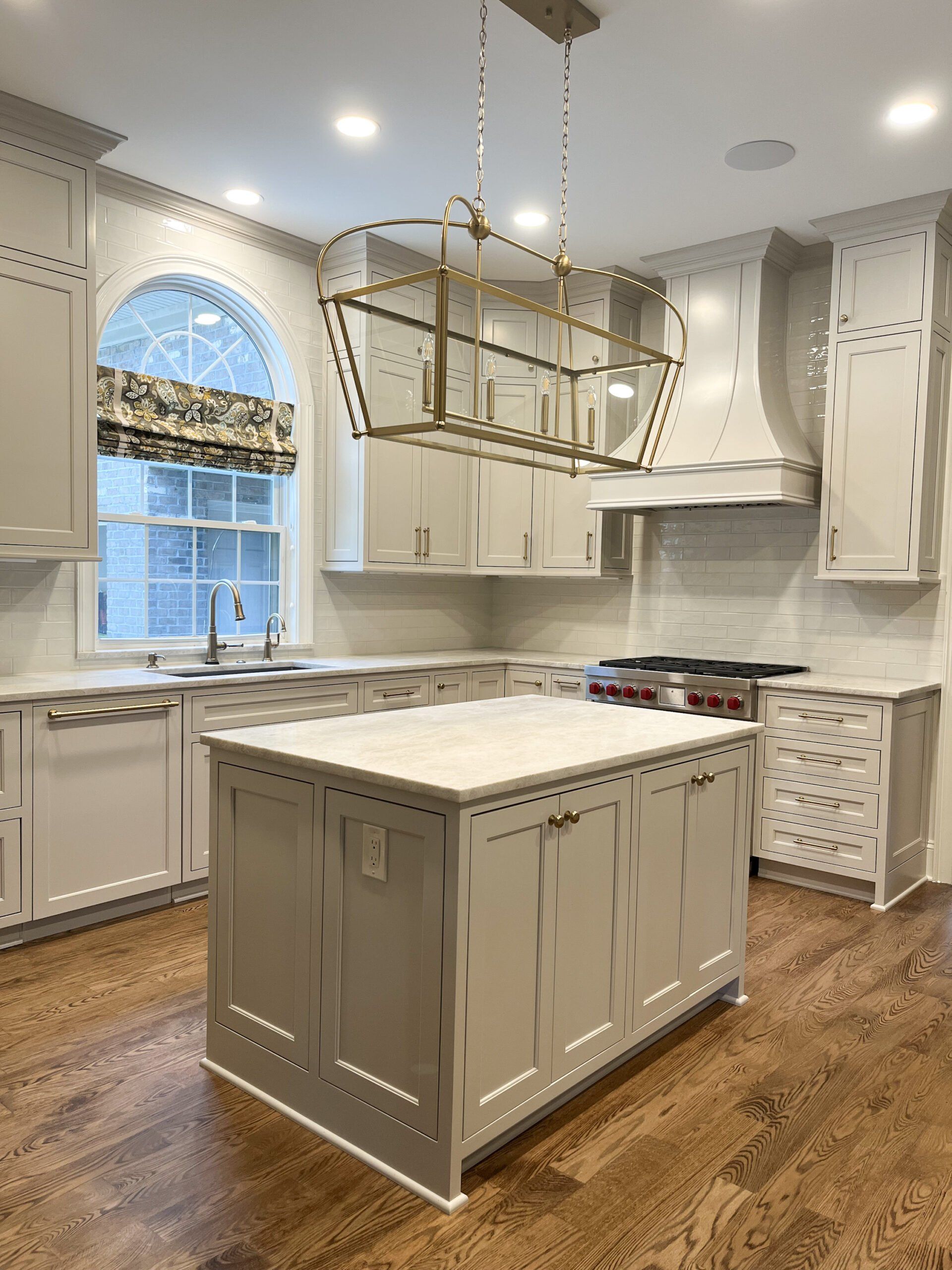 There is a large island in the middle of the kitchen.