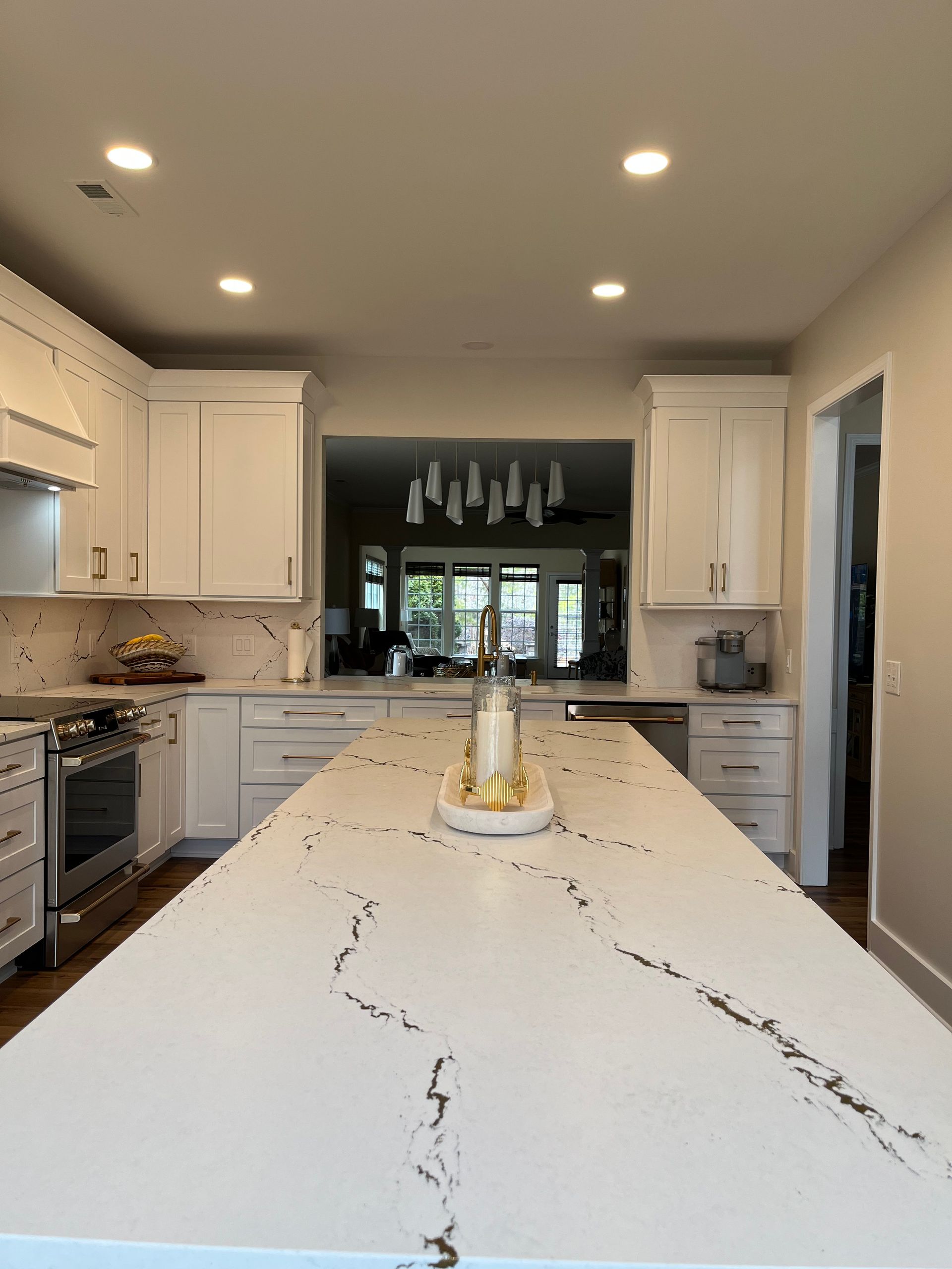 A kitchen with stainless steel appliances and a large island