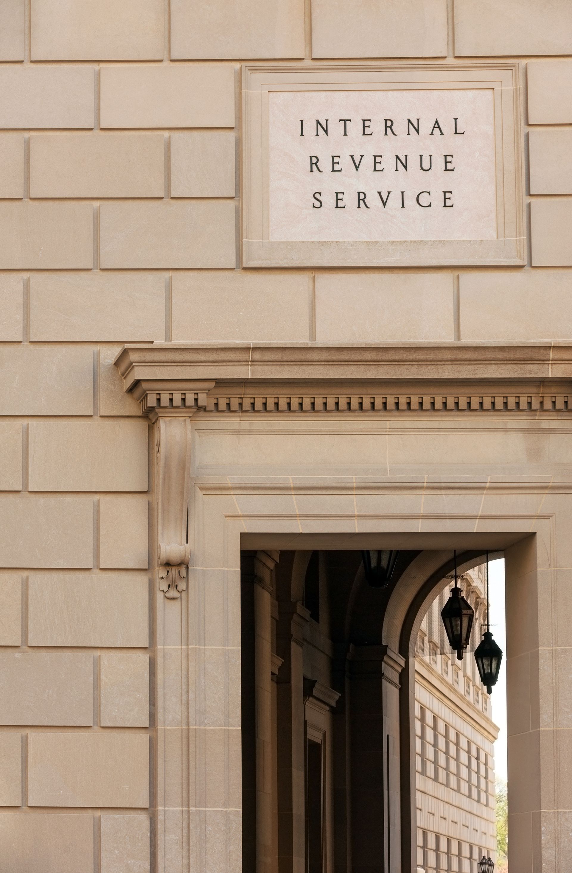 Sign above an arched entrance to an Internal Revenue Service building.