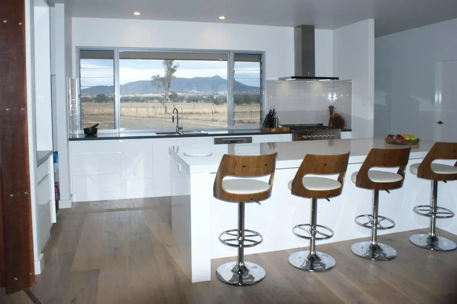 Modern Kitchen with White Island, Brown Bar Stools — Simmonds Kitchens in Gunnedah, NSW