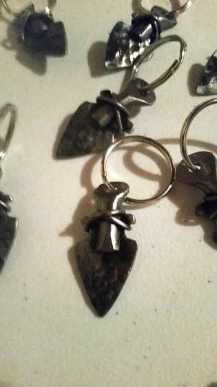 A bunch of keychains are sitting on a table.