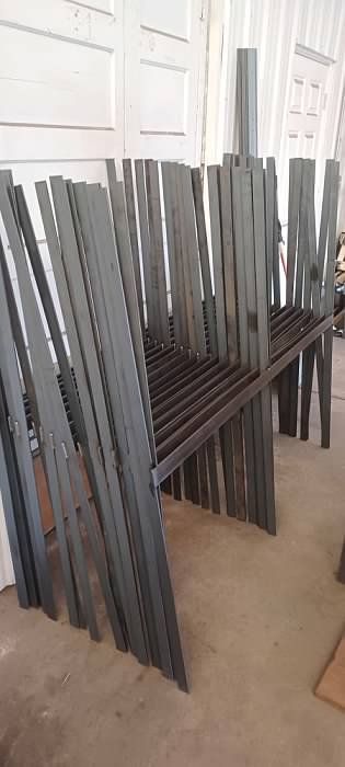 A bunch of wooden sticks are stacked on top of each other on a table.