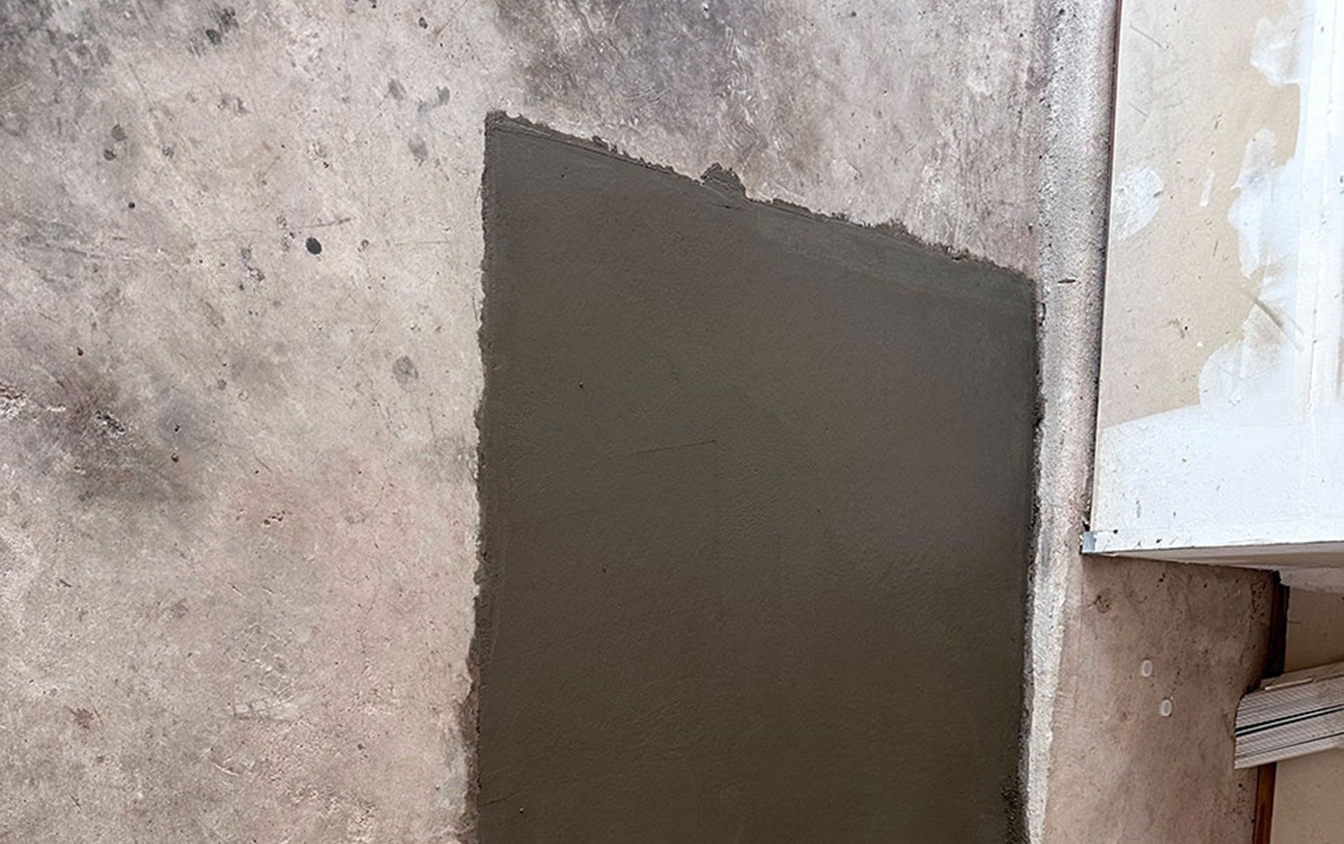 electrician at work. boring hole for electric outlet by power tool drill. 
