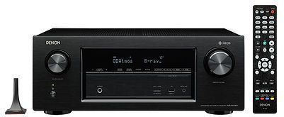 Black Denon receiver with remote and antenna.